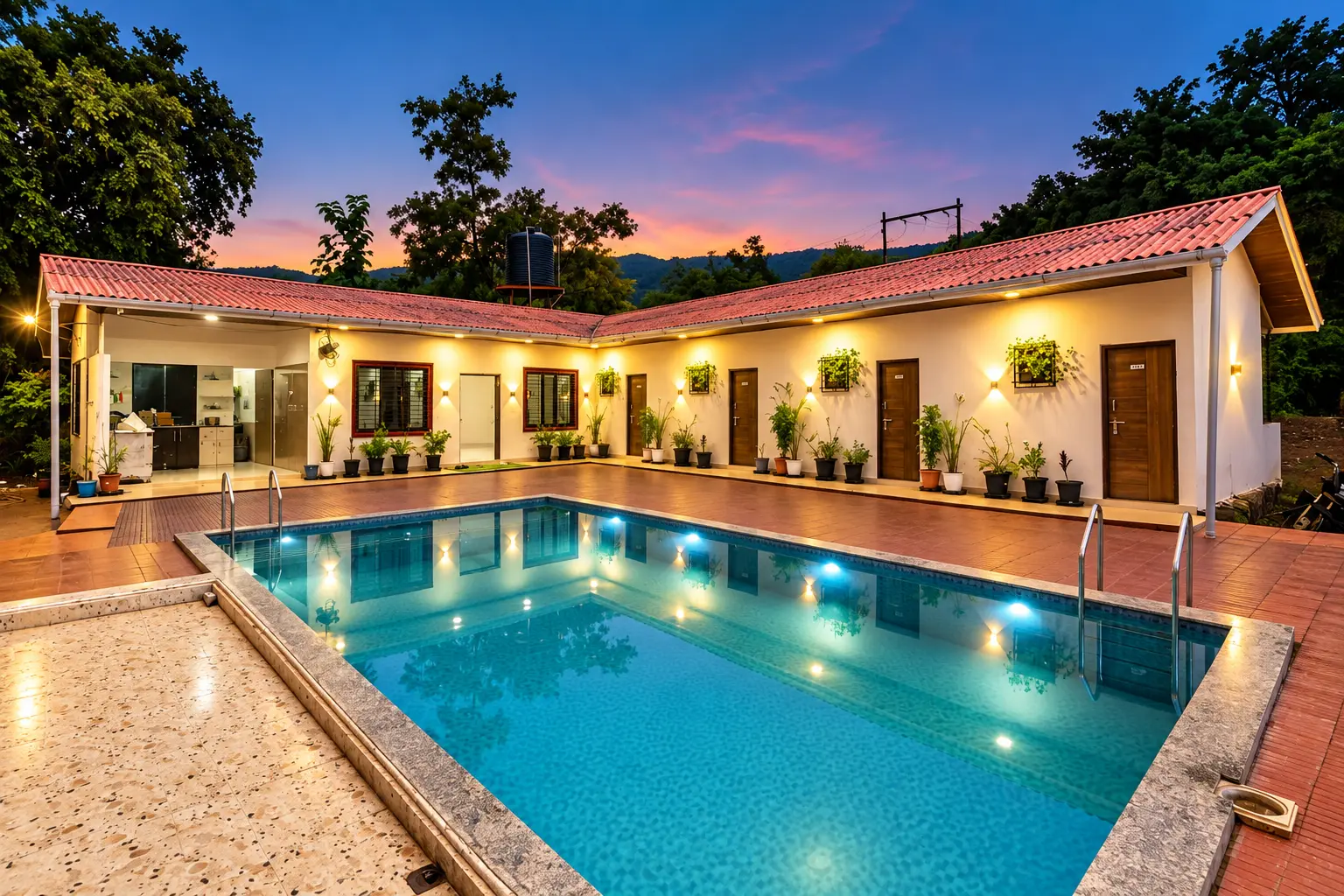 Villa Montierra pool and villa at dusk in Karjat